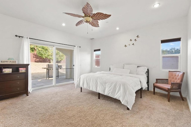 carpeted bedroom featuring access to exterior and ceiling fan