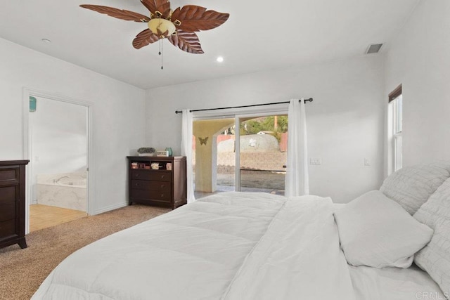 carpeted bedroom with access to exterior, ceiling fan, and ensuite bath