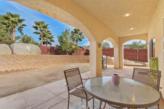 view of patio with a grill