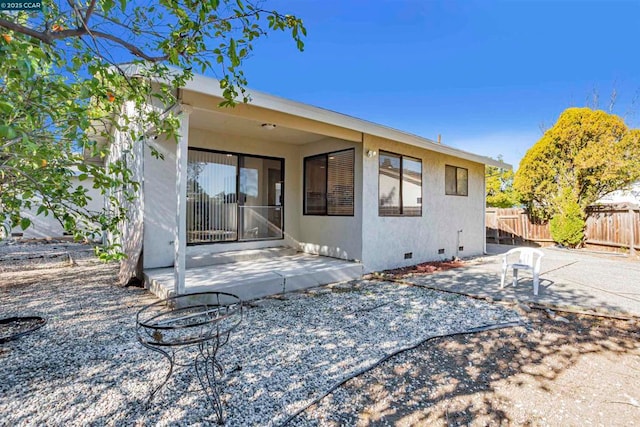 back of house with a patio