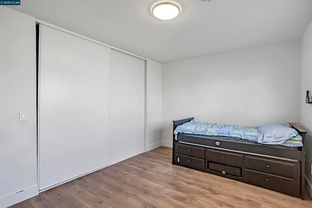 bedroom with light hardwood / wood-style flooring