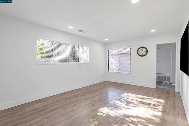 unfurnished room featuring light wood-type flooring