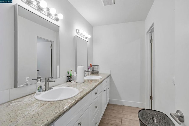 bathroom featuring tile patterned floors and vanity