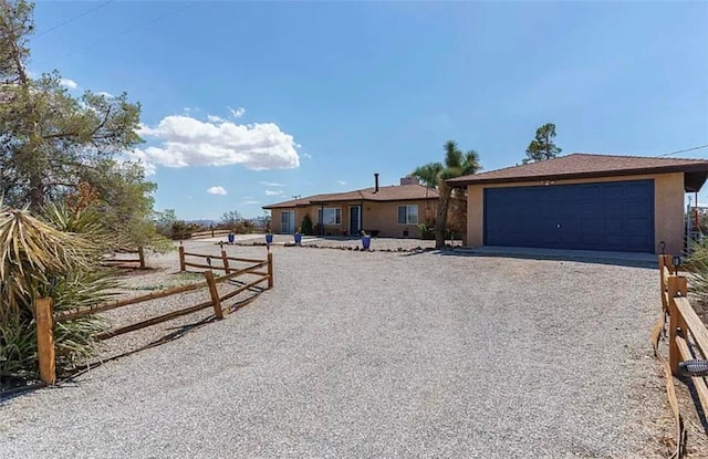 ranch-style house featuring a garage