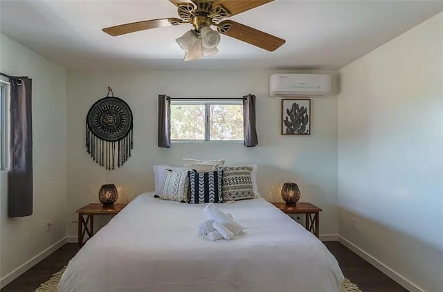 bedroom featuring ceiling fan, an AC wall unit, and dark wood-type flooring