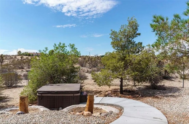 surrounding community featuring a hot tub