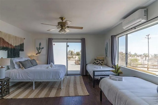 bedroom featuring multiple windows, access to exterior, a wall unit AC, and ceiling fan