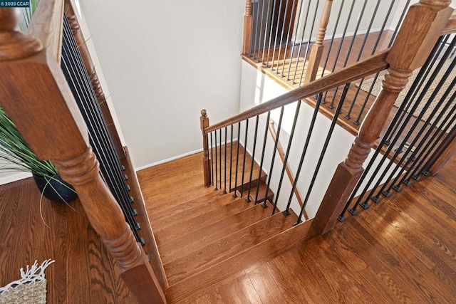 staircase featuring hardwood / wood-style floors