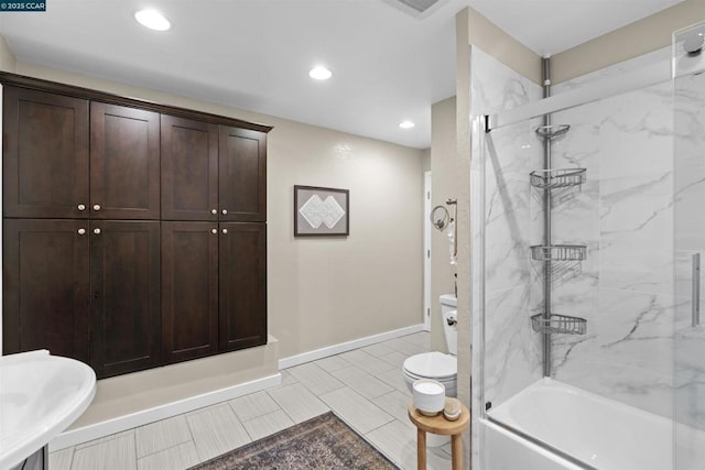 bathroom featuring toilet, shower / bath combination with glass door, and tile patterned flooring