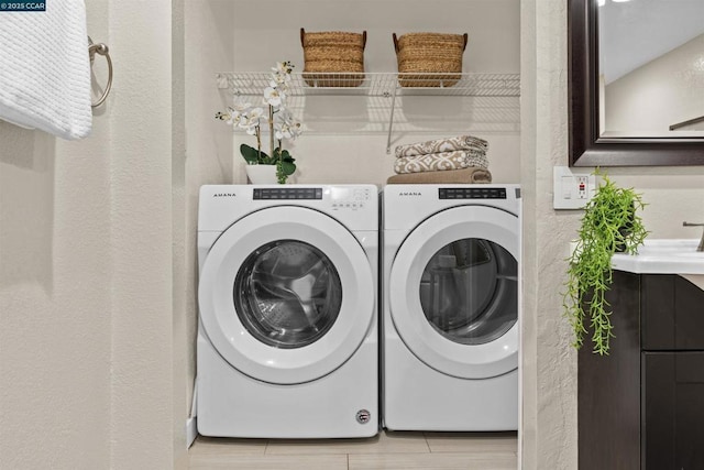 washroom featuring sink and washer and dryer