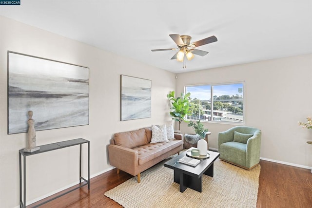 living room with hardwood / wood-style flooring and ceiling fan