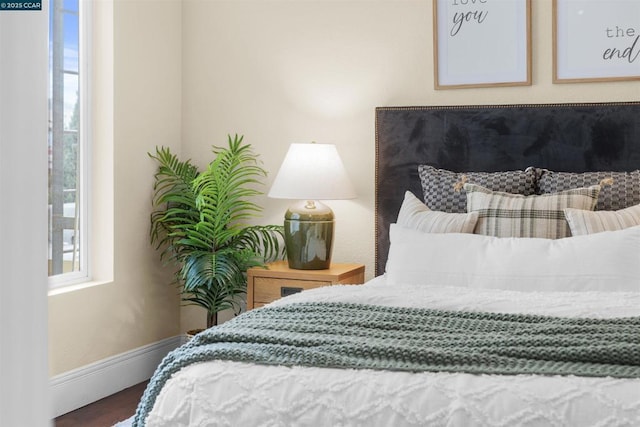 bedroom with hardwood / wood-style flooring