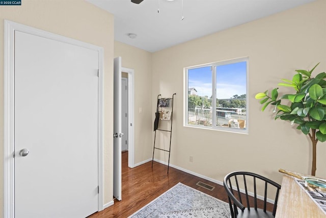 sitting room featuring ceiling fan and dark hardwood / wood-style flooring