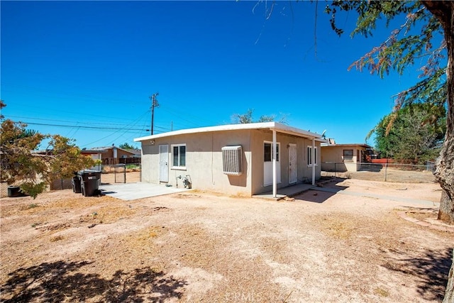 back of house with a patio