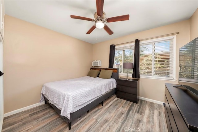 bedroom featuring ceiling fan and hardwood / wood-style flooring