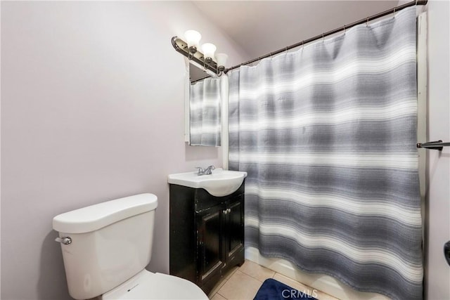 bathroom with vanity, toilet, and tile patterned floors