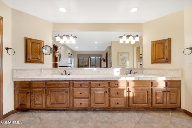 bathroom with vanity and backsplash