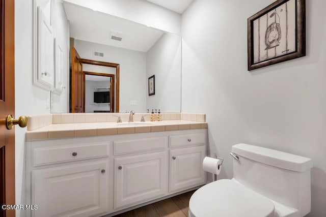 bathroom with vanity and toilet