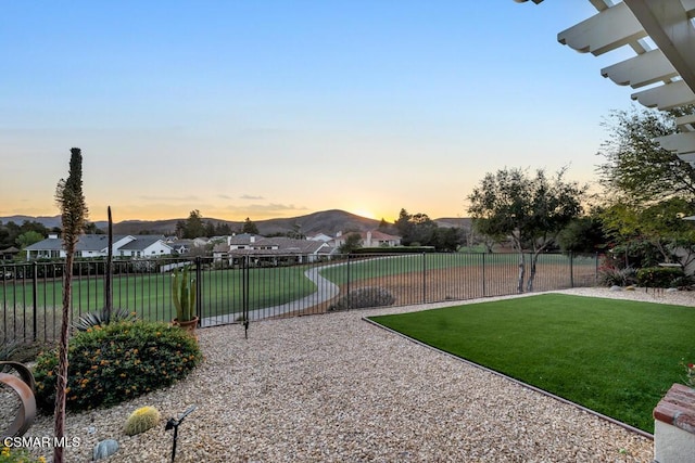 yard at dusk with a mountain view