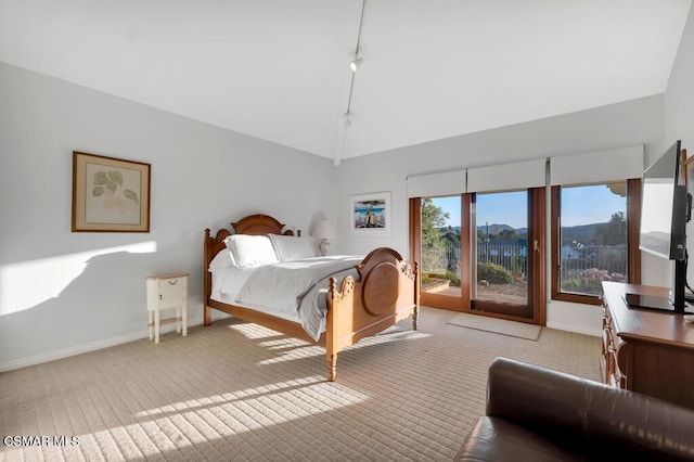 bedroom featuring access to exterior, light colored carpet, and high vaulted ceiling