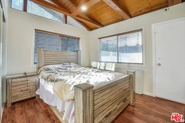 bedroom featuring dark hardwood / wood-style flooring, lofted ceiling with beams, and wood ceiling