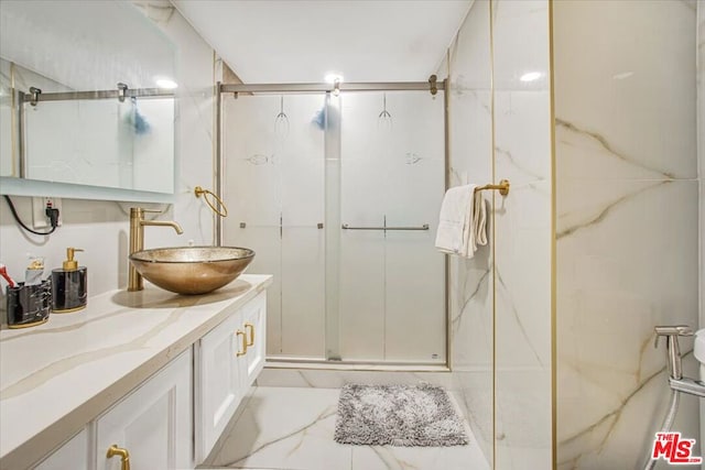 bathroom with vanity and an enclosed shower