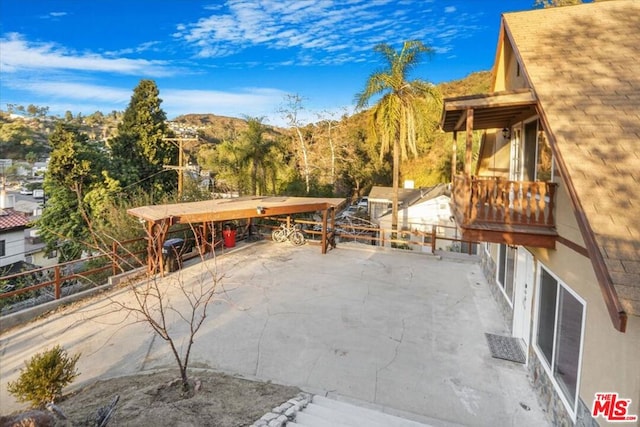 view of patio / terrace featuring a mountain view