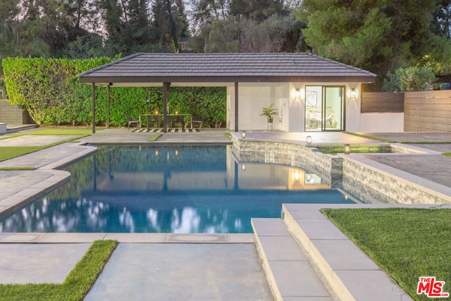 view of swimming pool with a patio area and a gazebo