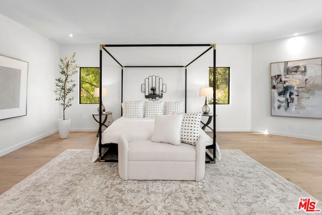 bedroom with hardwood / wood-style floors