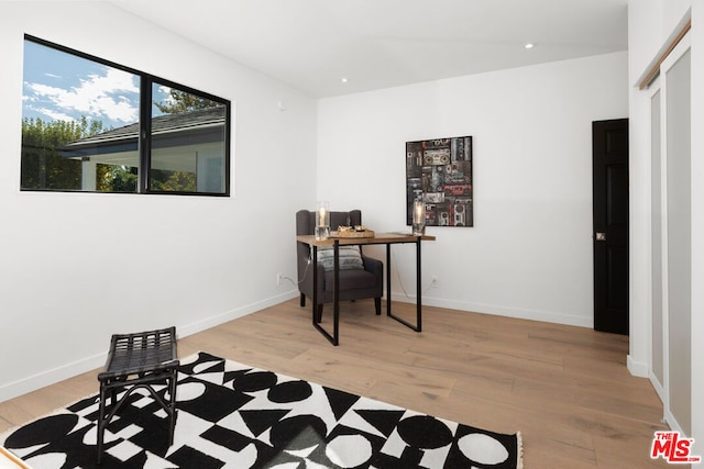 office space with light wood-type flooring