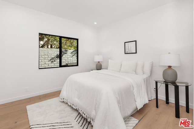 bedroom with light hardwood / wood-style floors