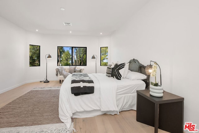 bedroom with light wood-type flooring