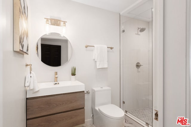 bathroom with a shower with shower door, toilet, and vanity