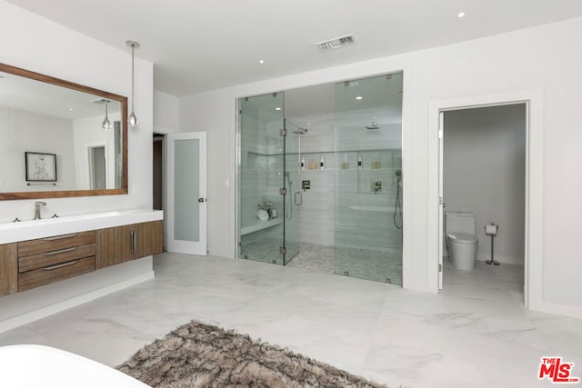 bathroom featuring toilet, an enclosed shower, and vanity