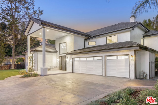 view of front of property with a garage