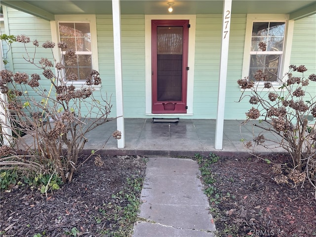 doorway to property with a porch