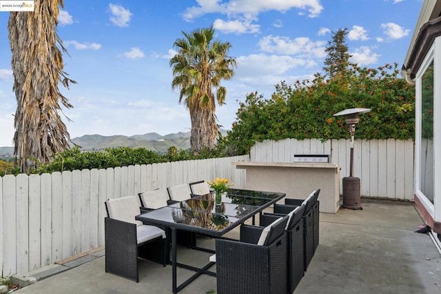 view of patio / terrace featuring a mountain view