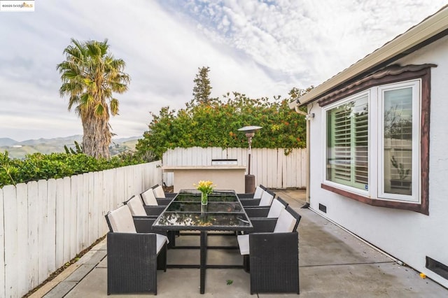 view of patio / terrace with a mountain view