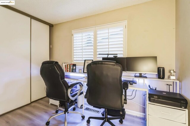 office area featuring hardwood / wood-style floors