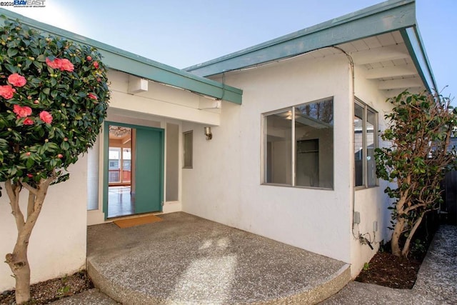 doorway to property featuring a patio