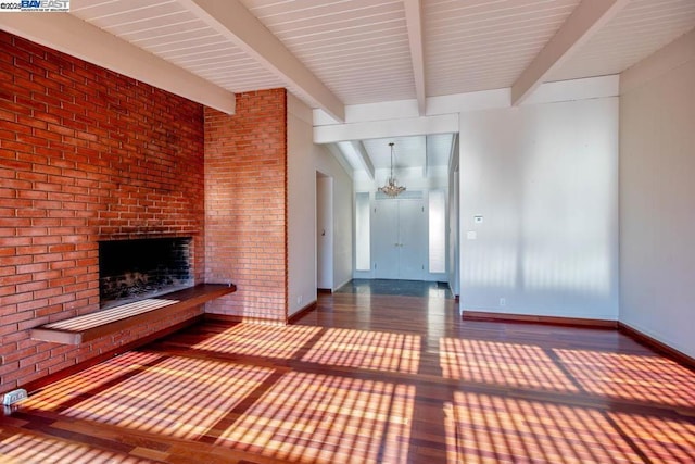 unfurnished living room featuring beamed ceiling and a fireplace