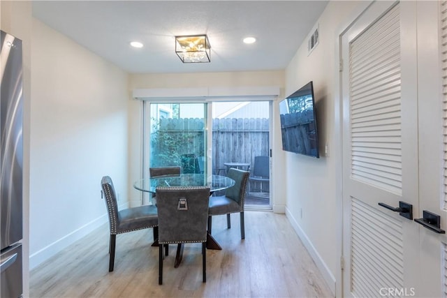 dining room featuring light wood-type flooring