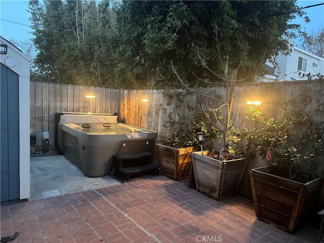 view of patio with a hot tub