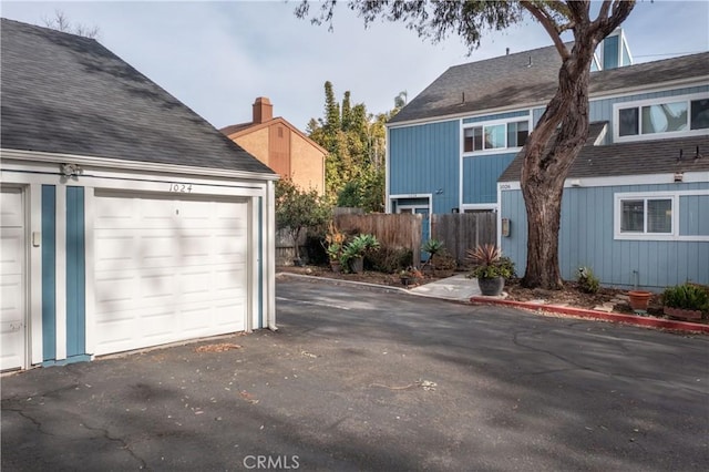 view of side of property with a garage