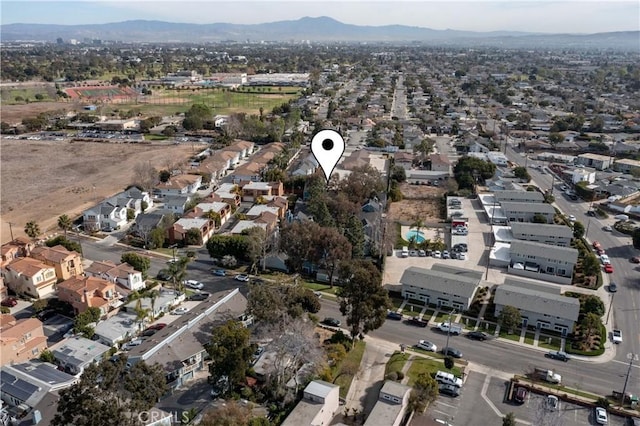 birds eye view of property featuring a mountain view