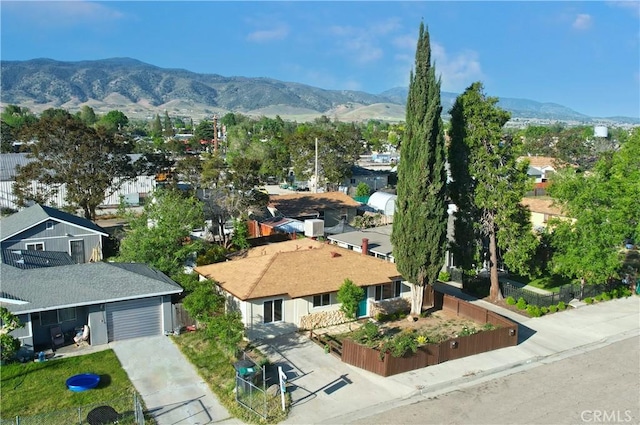 aerial view of residential area with mountains