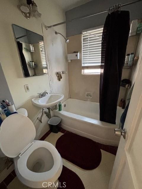 full bathroom with sink, toilet, and shower / bathtub combination with curtain