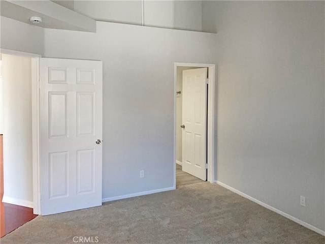 unfurnished bedroom featuring carpet