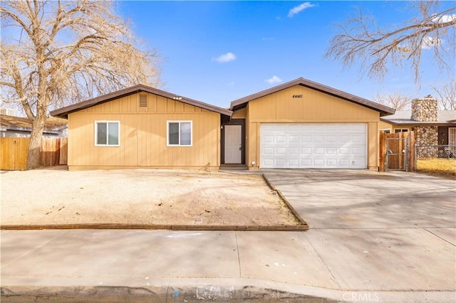 ranch-style house featuring a garage