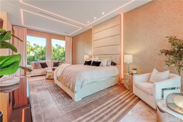 bedroom featuring marble finish floor